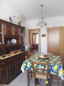 a kitchen with a table with a table cloth on it at Casa della camperia in Favignana