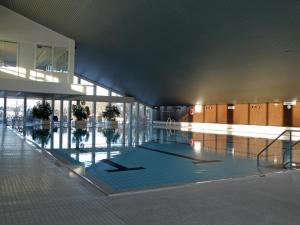 a large room with a pool of water in a building at Ferienpark Sierksdorf Nautilus Panorama-Meerblick in Sierksdorf