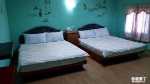 Ένα ή περισσότερα κρεβάτια σε δωμάτιο στο Pthles Guest house