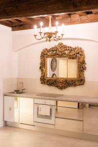 a bathroom with a mirror and a sink at AB Ljubljana - The Residence in Ljubljana