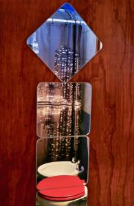 a glass wall with a toilet in a room at B&B Mi Casa Es Tu Casa in Mar Azul