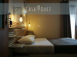 Postel nebo postele na pokoji v ubytování Casa Duci