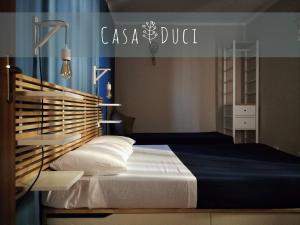 Postel nebo postele na pokoji v ubytování Casa Duci