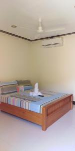 Кровать или кровати в номере OYO 938 Citrine Travel Lodge