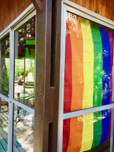 a rainbow colored window on a house at B&B Mi Casa Es Tu Casa in Mar Azul