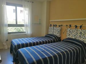 A bed or beds in a room at CASA LA ROCA