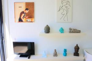 a television sitting on a shelf in a living room at Casa Nemo Cotillo Mar in El Cotillo