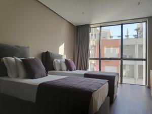 Postel nebo postele na pokoji v ubytování Supreme Hotel