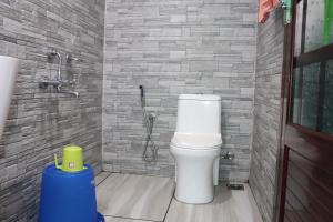 a bathroom with a toilet and a shower at Friends Cruise, Nightstay Houseboat in Alleppey +96 photos