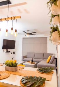 a living room with a couch and a table at Boho Condominium and Unique Comfort in Tijuana in Tijuana