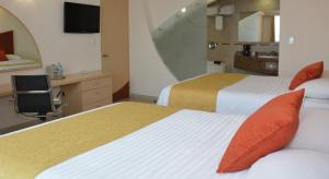 Krevet ili kreveti u jedinici u okviru objekta Hotel Magico Inn