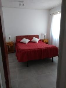 Кровать или кровати в номере Mares Ramallo 1