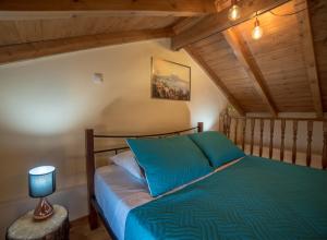 Letto o letti in una camera di Menecrates Rustic - San Matteo