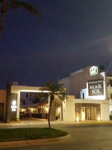 a building with a sign that reads market set at Mar Sol Bungalows & Hotel in Mazatlán