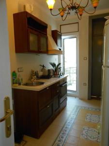 a kitchen with a sink and a counter top at Orient Express Guest House in Sofia +26 photos