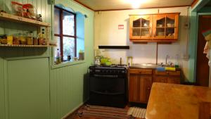 Kuchyň nebo kuchyňský kout v ubytování Hostal La Casa del Carpintero