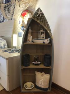 a shelf in a room with a play house at Jenny's Country Dreamhouse in Arezzo