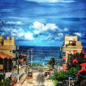 a painting of a street next to the ocean at Morada d'Omar 4 Ilhas in Bombinhas