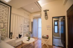 a living room with a couch and a table at Salmon B&B in Hualien City