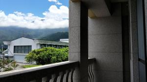 a view of a building from a balcony at Salmon B&B in Hualien City
