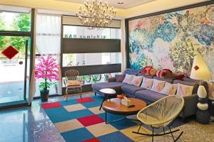 a living room with a couch and a table at Salmon B&B in Hualien City