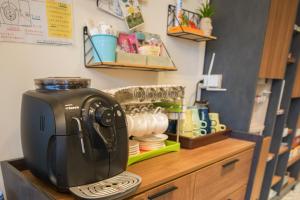a coffee maker sitting on top of a counter at Salmon B&B in Hualien City