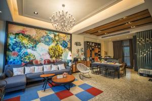 a living room with a couch and a table at Salmon B&B in Hualien City