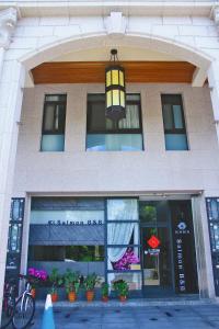a building with a hanging light in front of it at Salmon B&B in Hualien City