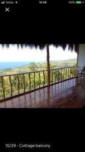 a view of the ocean from the balcony of a house at Hillside Village apartment 72sqm size with kitchen in Siquijor