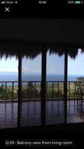 a view from a room with a view of the ocean at Hillside Village apartment 72sqm size with kitchen in Siquijor
