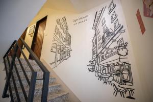 a stairway with a drawing of a street at Salmon B&B in Hualien City