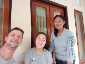 a group of three people standing in front of a door at House market in Sidemen