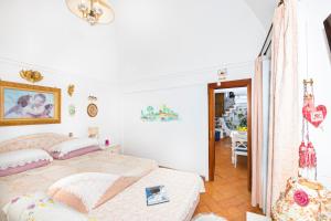 Posteľ alebo postele v izbe v ubytovaní CASA PERLA