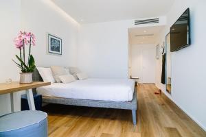 Postel nebo postele na pokoji v ubytování NUMA HOTEL