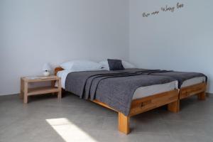 a bedroom with a large bed with a wooden frame at The FOXhouse in Tolmin