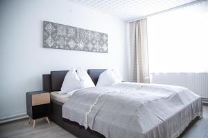 Una cama o camas en una habitación de Spitaler Apartments