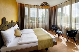 Postel nebo postele na pokoji v ubytování Focus Hotel + 22 fotografií