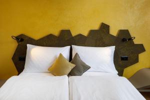 Letto o letti in una camera di Focus Hotel