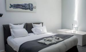 Letto o letti in una camera di Hôtel Quatorze