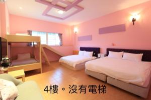 Voodi või voodid majutusasutuse 橘子喵旅宿 toas