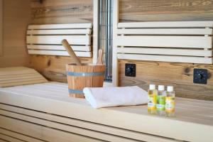 a sauna with bottles of honey and a towel at Ferienhaus Almruhe in Schwanberg