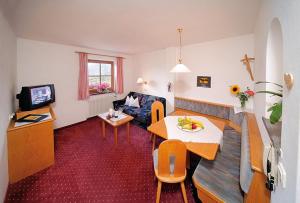 Μια τηλεόραση ή/και κέντρο ψυχαγωγίας στο Ferienwohnungen Baumannsog