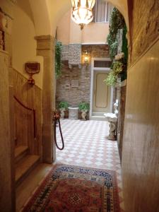an entrance to a hallway with a rug on the floor at Locanda Cà Le Vele in Venice