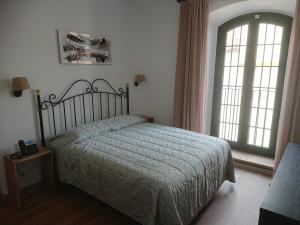 Posteľ alebo postele v izbe v ubytovaní Jardi de Pedra