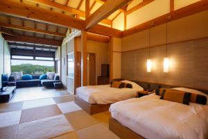 Ένα ή περισσότερα κρεβάτια σε δωμάτιο στο Teisho Basaratei +77 φωτογραφίες