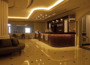 a lobby of a hotel with a bar in it at Rona Al Khobar Hotel in Al Khobar