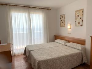 Postel nebo postele na pokoji v ubytování Hotel Mare Nostrum