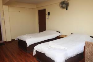 Postel nebo postele na pokoji v ubytování Kathmandu Madhuban Guest House
