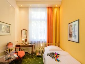 Postel nebo postele na pokoji v ubytování Hotel Palmenhof