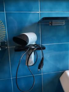 a blow dryer on a wall in a bathroom at Villa Artemisia in Borgo a Buggiano
